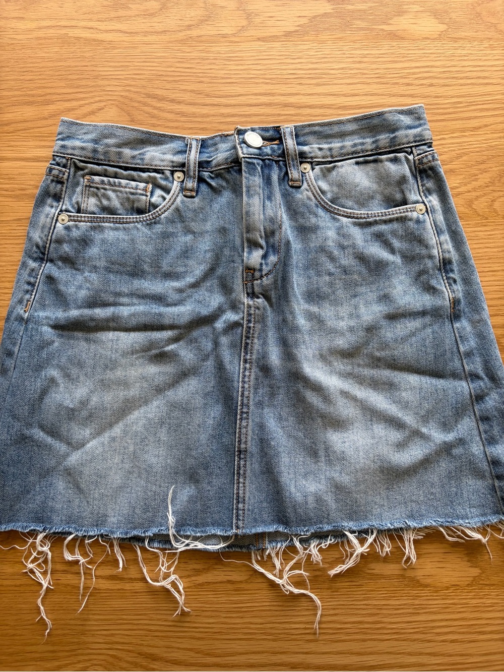Blank NYC Washed Light Blue Denim Mini Skirt with Raw Hem